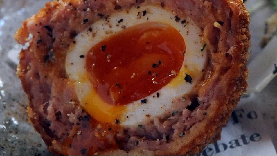Ham hock Scotch eggs, with pickled chicory and blue cheese